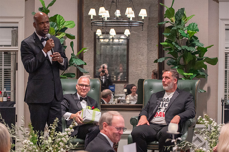 St. Mary’s Courageous Leaders Gala celebrating Coach Mark Richt as he sits onstage.